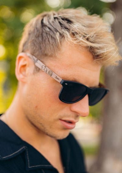 Native Wooden engraved sunglasses on a model in Sweden.