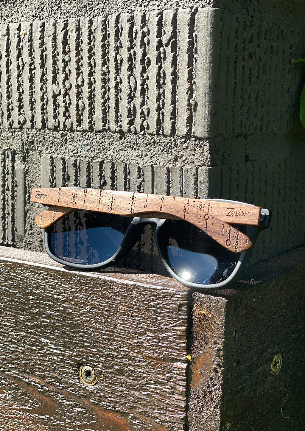 Engraved wooden sunglasses Inspired by the computers and the programing languages. Photo taken outside in the Swedish summer.