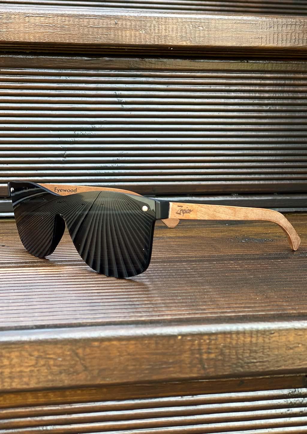 Eyewood tomorrow is our modern cool take on classic models. This is Taurus with black lenses. Nice wooden sunglasses. Outside with details.