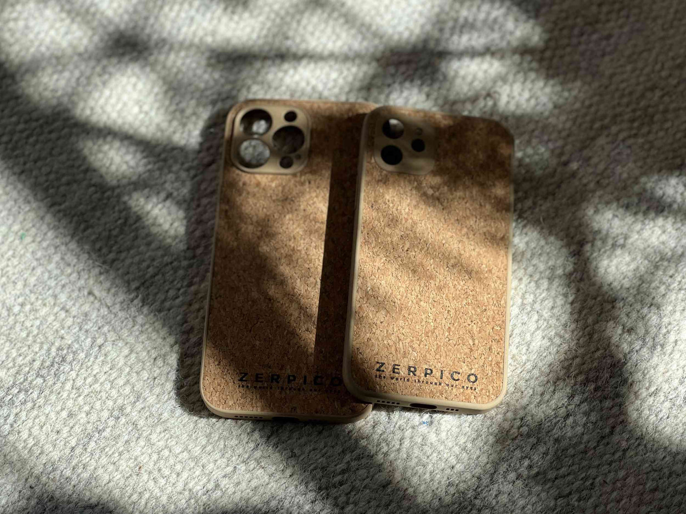 Mobile phone cases made of wood and cork.