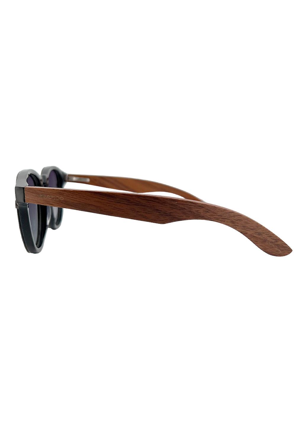 Our handmade Eyewood ReInvented Wooden and Acetate Sunglasses. This is our round style. Studio photo from the side.