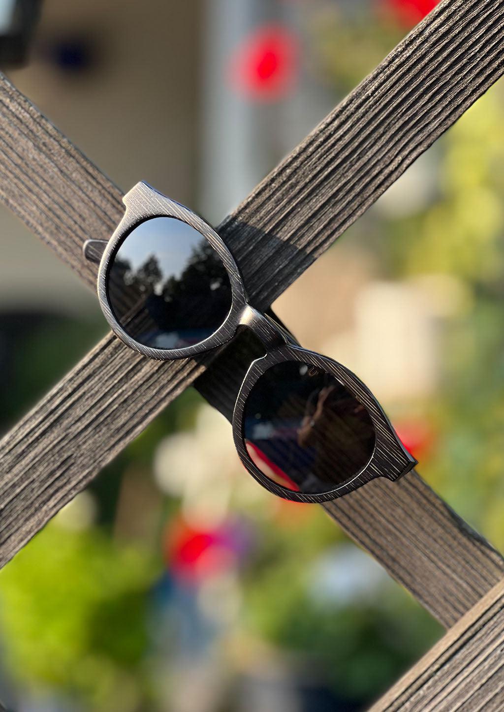 Our handmade round wooden sunglasses called midnight bamboo.
