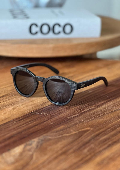 Our handmade round wooden sunglasses called midnight bamboo. Photo showing the details.