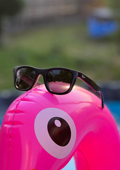 Our handmade wayfarer wooden sunglasses called Obsidian Shade. An other photo taken by the pool.