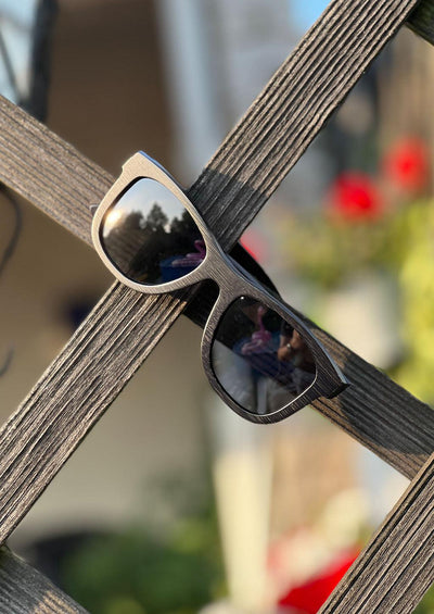 Our handmade wayfarer wooden sunglasses called Onyx Edge. Photo taken in the Swedish summer.