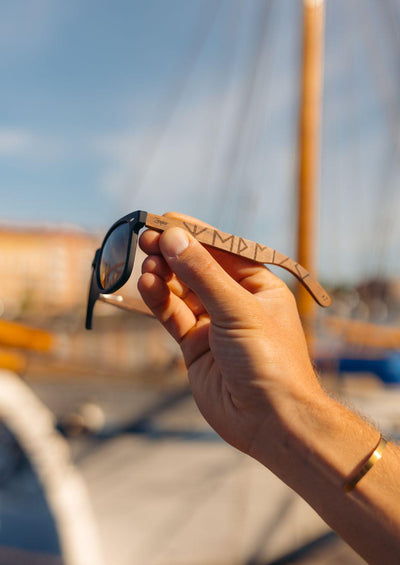 This is our special edition sunglasses Viking runes. - Close up in Sweden Halmstad by a ship.