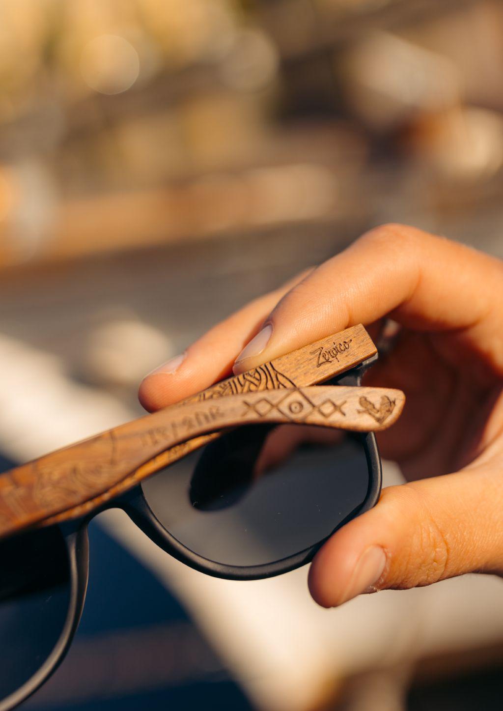Close up on the patterns on our special wooden sunglasses with viking patterns.