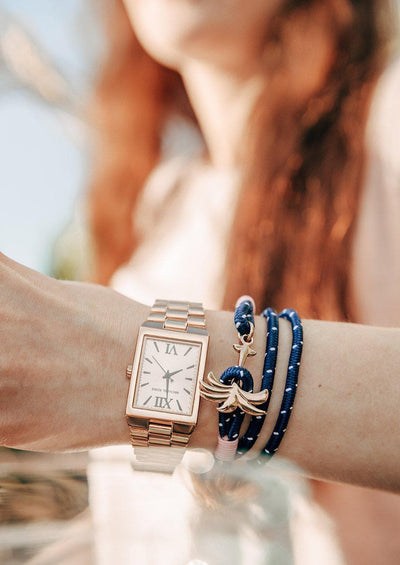 Daybreak - Triple - Season two Palm anchor bracelet with pink and blue nylon band. On models arm.