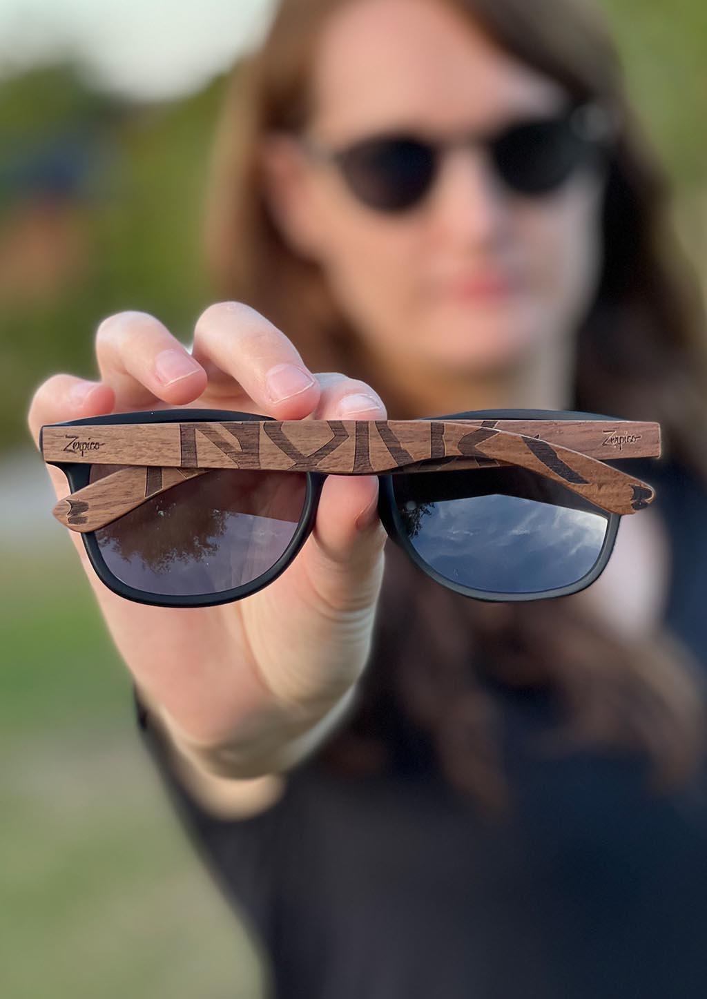 This is our special edition sunglasses Viking runes Norway version. Close up lifestyle photo.