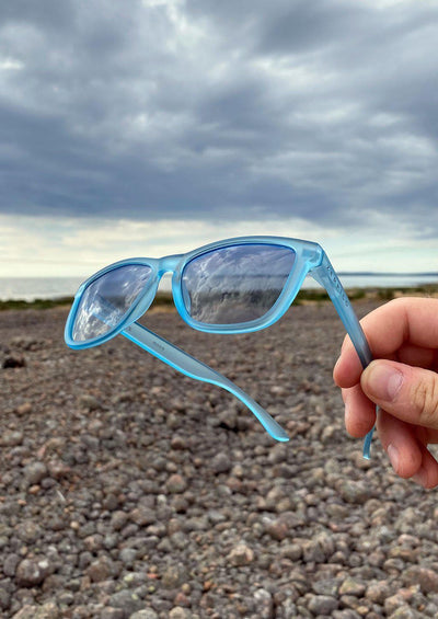 Our Mood V2 is an improved version of our last wayfarers. Plastic body for great quality and durabilty. This is Belize with blue frame and blue lenses. Outside from the side.