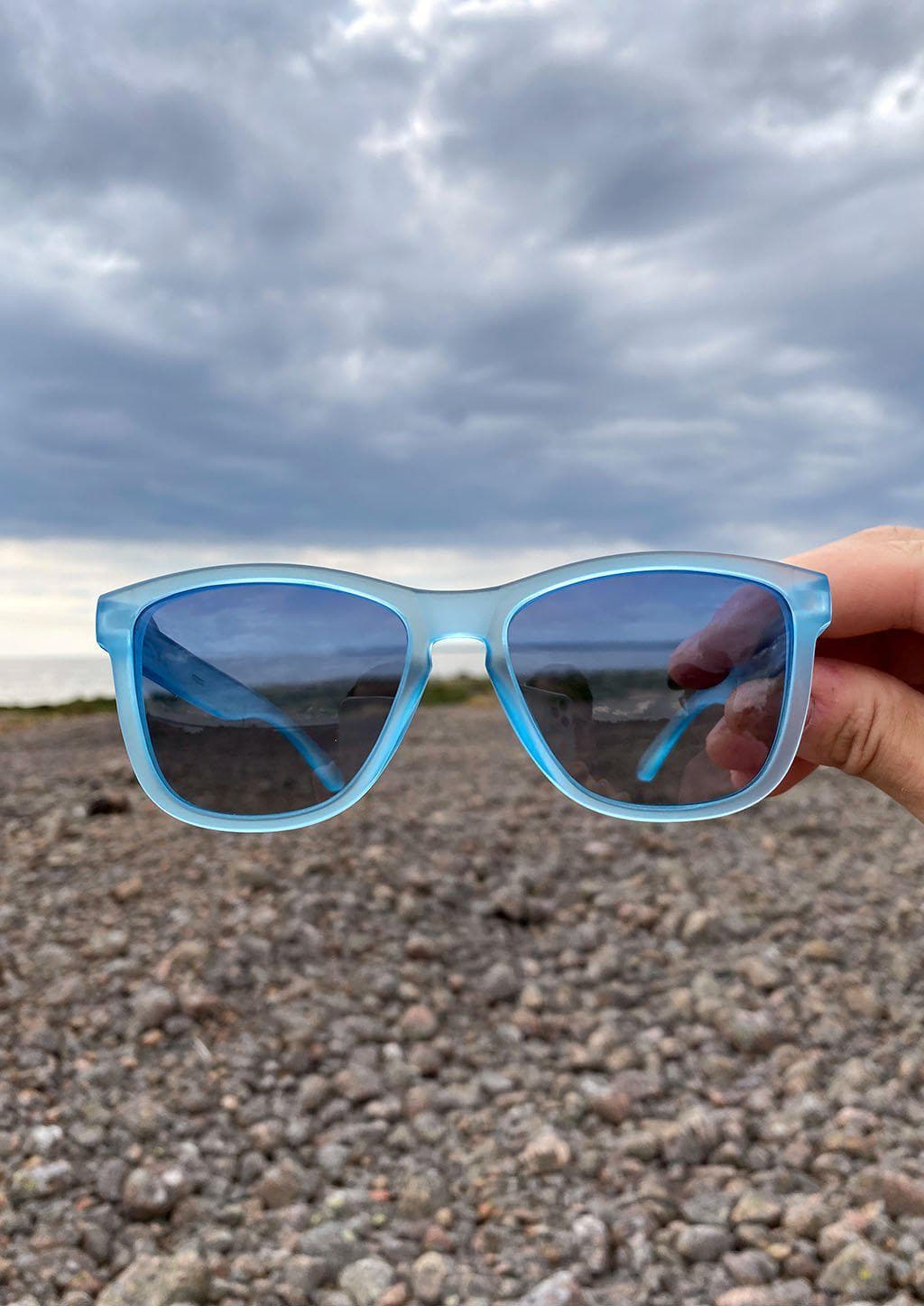Our Mood V2 is an improved version of our last wayfarers. Plastic body for great quality and durabilty. This is Belize with blue frame and blue lenses. Outside from the front.