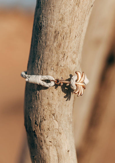 Serene - Season two Palm anchor bracelet with white leather. Close up in nature.