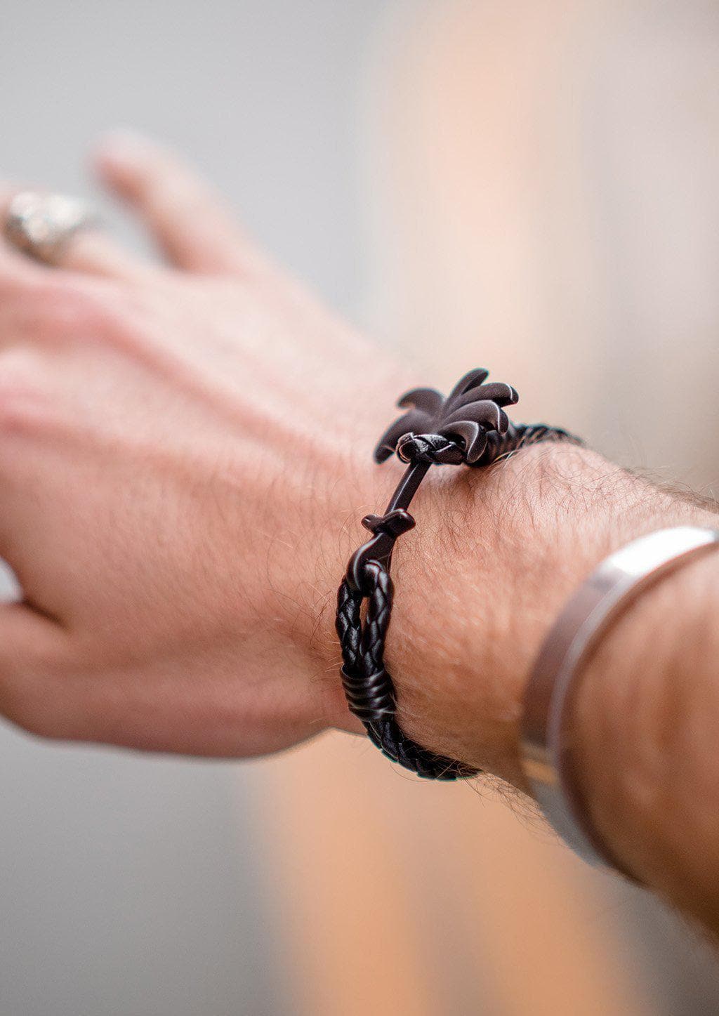 Pitch Black - Palm anchor bracelet with black leather. Lifestyle photo on wrist.