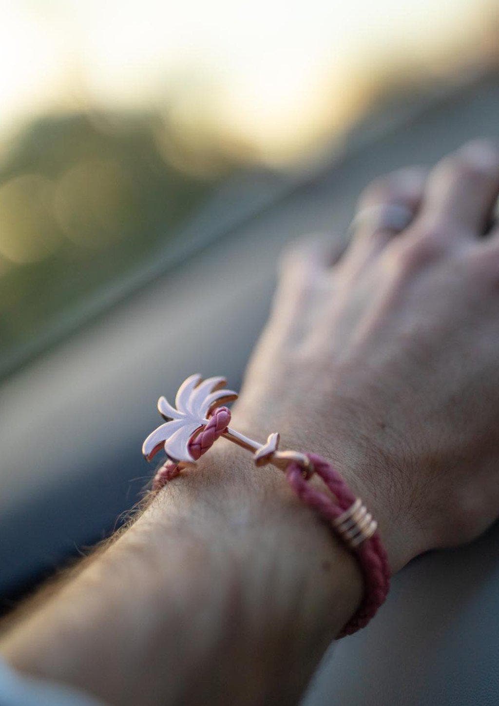 Flamingo Rose - Palm anchor bracelet with pink leather. On male models wrist.