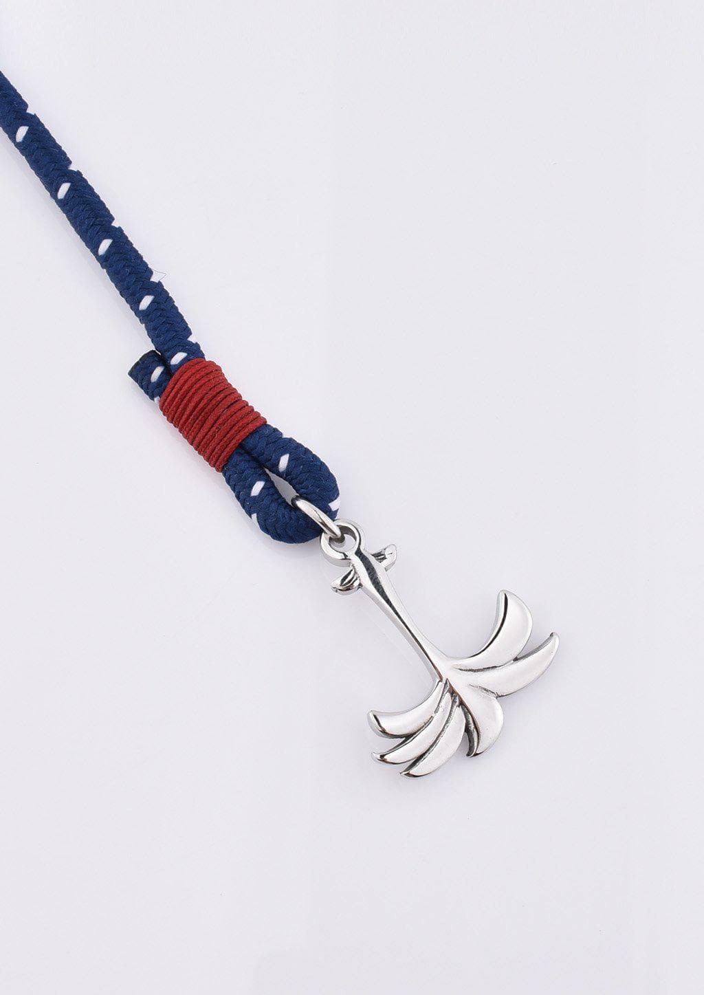 Voyager - Single - Season two Palm anchor bracelet with blue and red nylon band. Close up on palm.