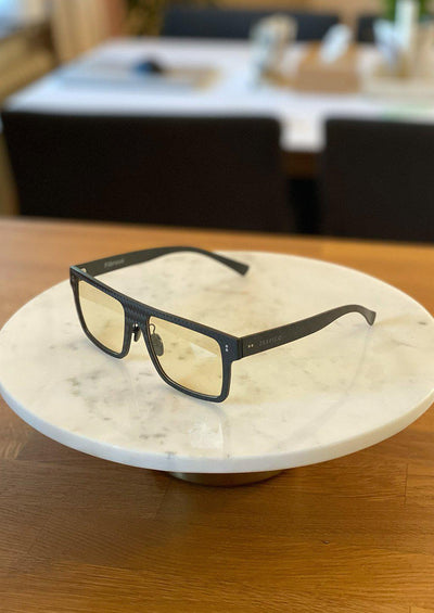 Our Anti Blue Light Square version of our Fibrous Carbon Fiber glasses. Perfect for gamers. Also turns dark outside. Photo taken i daylight inside.