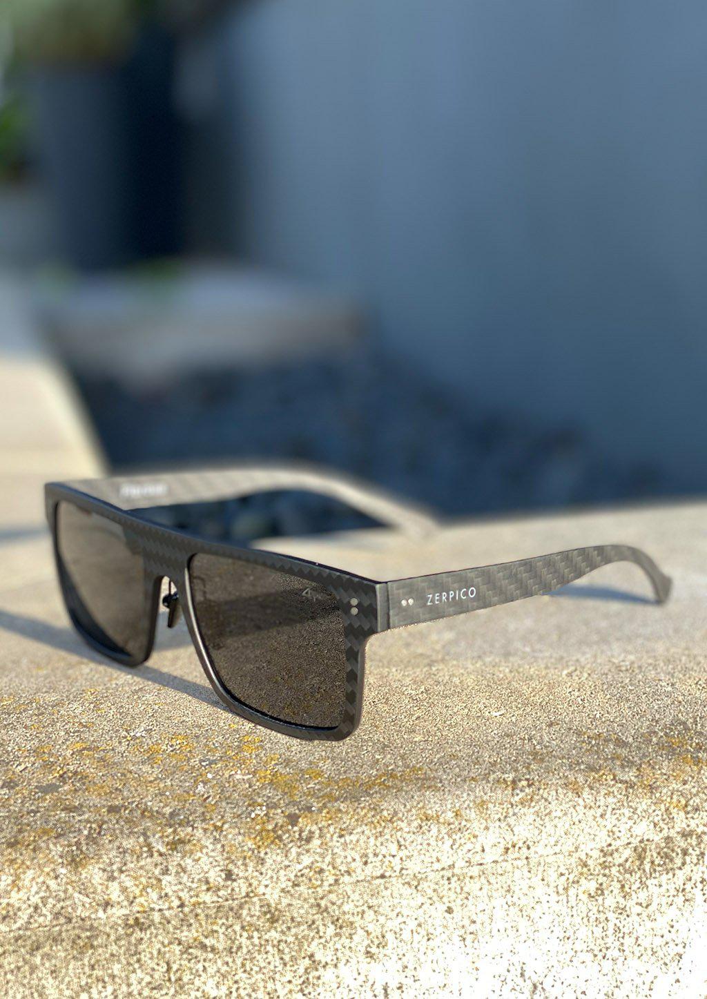 Carbon Fiber Square Sunglasses photo taken outside in the Swedish summer.