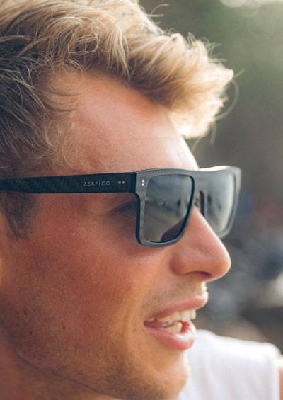 Our carbon fiber square sunglasses on a blonde male model.