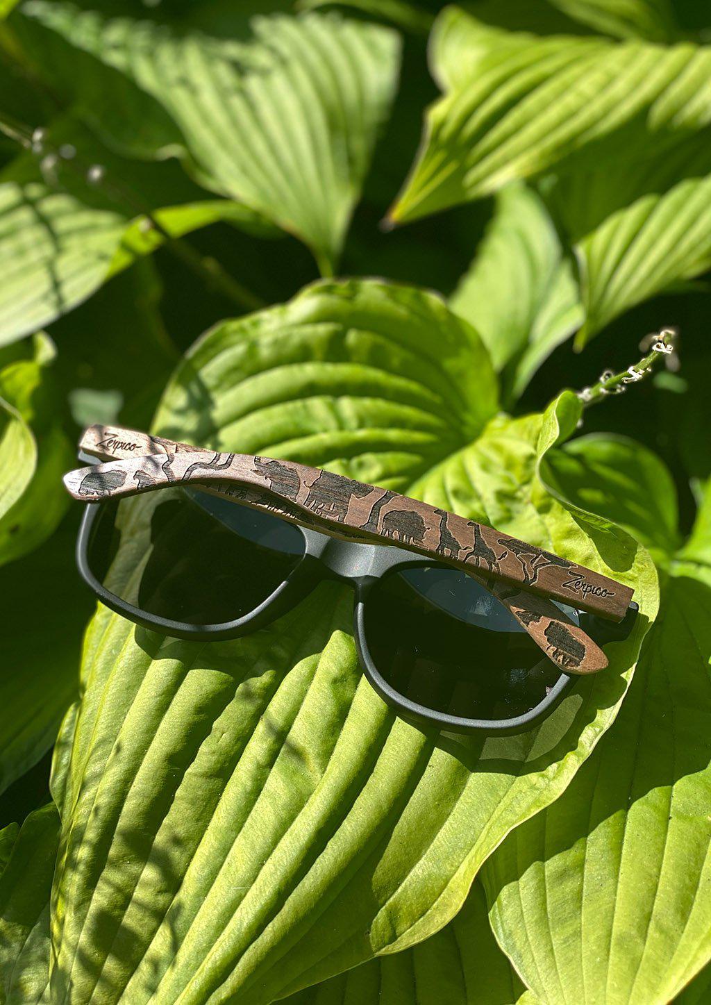 Engraved wooden sunglasses Inspired by the open plains and animals of the African savanna. Outside where it belongs among the green outdoors.