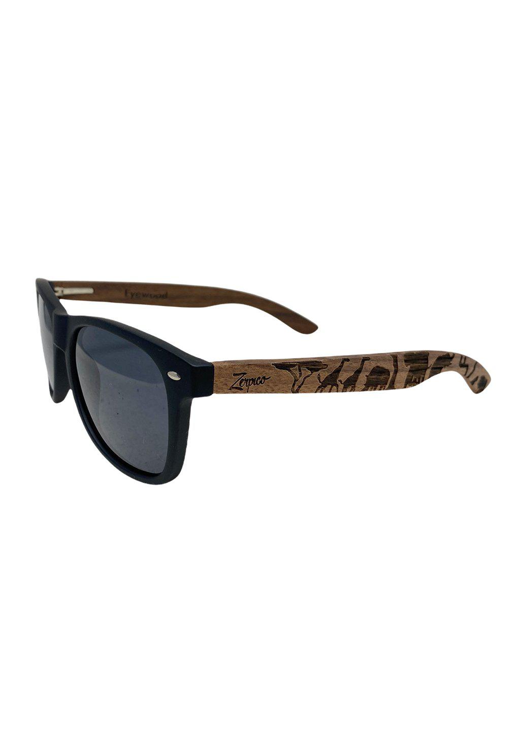 Engraved wooden sunglasses Inspired by the open plains and animals of the African savanna. Studio shoot from the front.