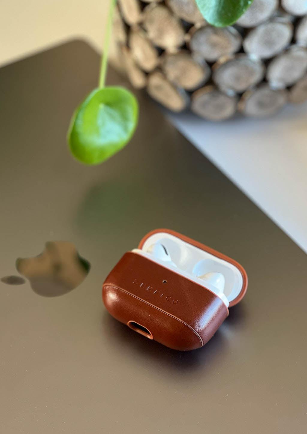 Zerpico Leather Airpods case. Our case open on a Macbook pro.