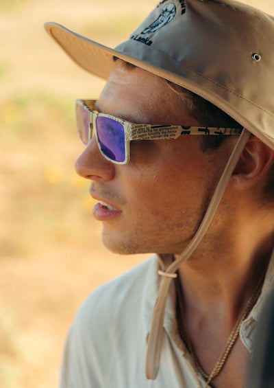 ReVision Square - Eco-Friendly Recyclable Paper Sunglasses on a model in Africa.