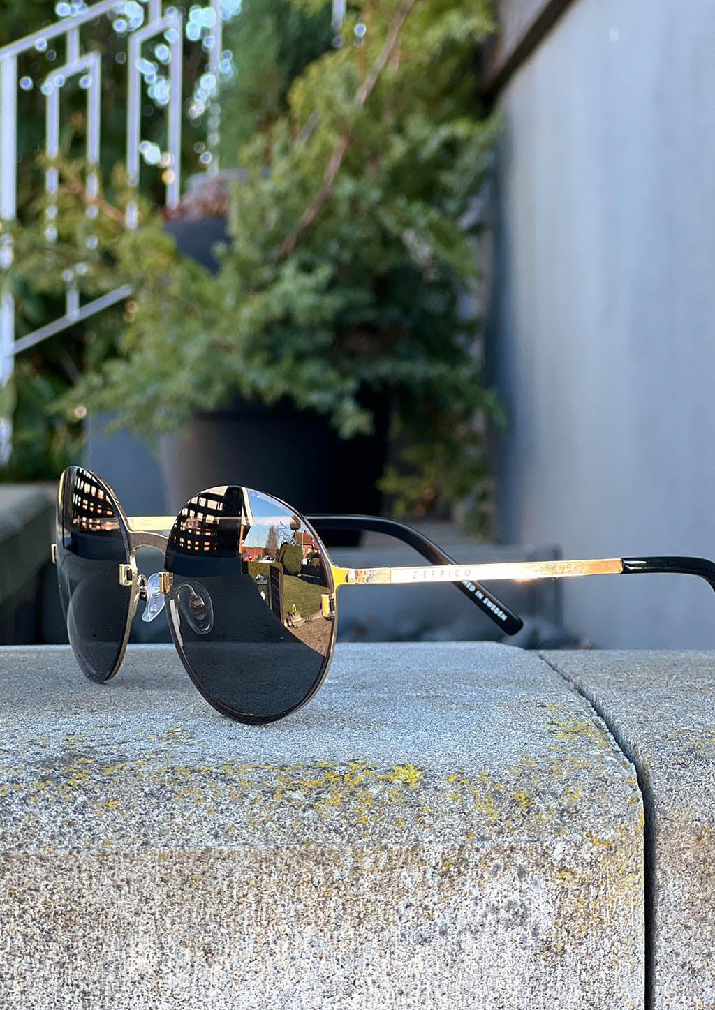 Titan - Titanium Round Sunglasses V2 - 24K Gold Plated with real gold. Photo taken outside in Sweden.