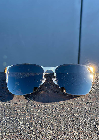 Titan - Titanium Wayfarer Sunglasses V2 - 24K Gold Plated with real gold. Front photo taken outside.