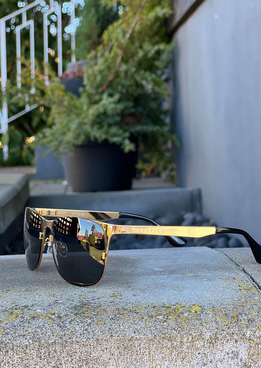 Titan - Titanium Wayfarer Sunglasses V2 - 24K Gold Plated with real gold. Photo taken outside in Sweden.