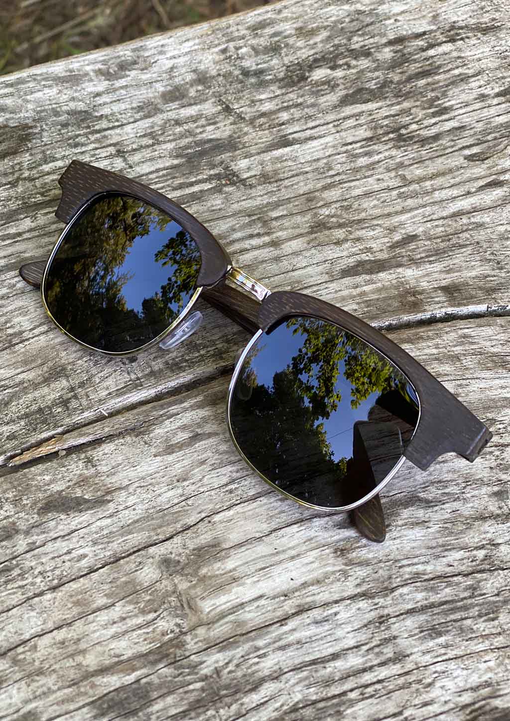 Eyewood Clubmasters is our cool take on classic model. This is Skyler with dark lenses. And also this model is made in all wood. Outside in the sun from the front.