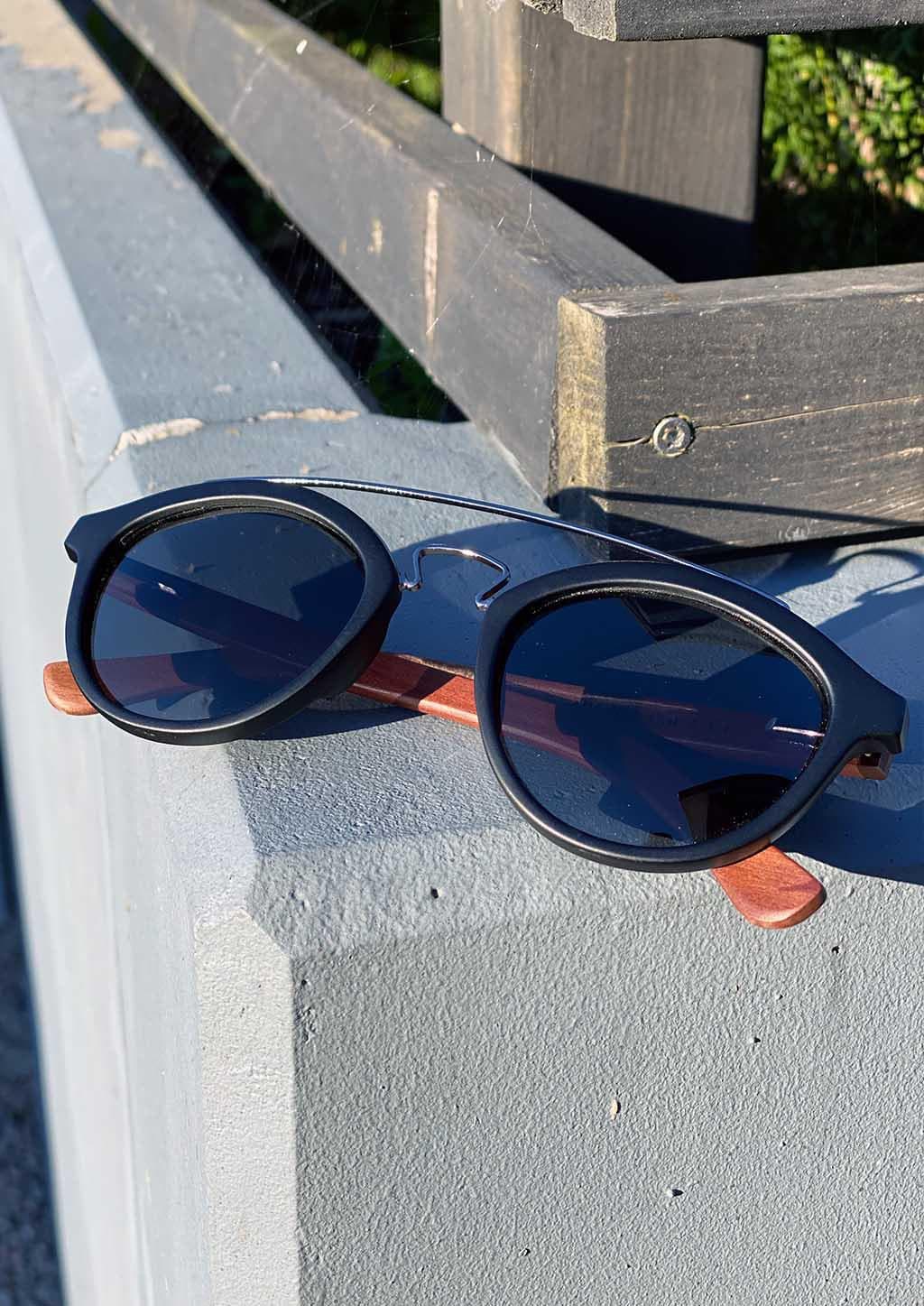Handmade wooden round sunglasses that guaranteed to give you a natural feeling of comfort and design.  Lyric is a little bit special model of our round take on sunglasses. With some cool extra details. Close up with details outside.