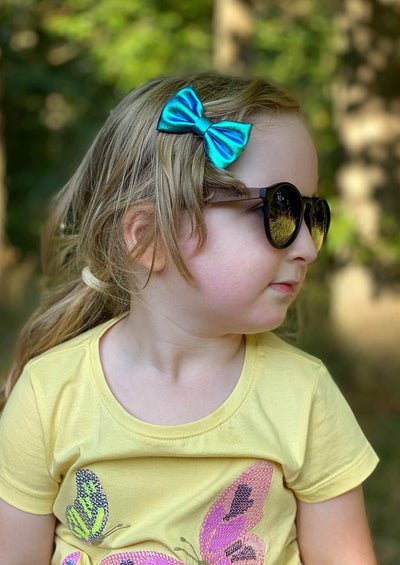 Eyewood Cubs - Simba - Wooden sunglasses for kids. On kid model in summer Sweden.