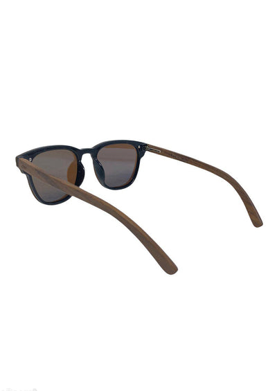 Eyewood tomorrow is our modern cool take on classic models. This is Delphinus with blue mirror lenses. With walnut wooden sides. Studio shoot taken from the back.