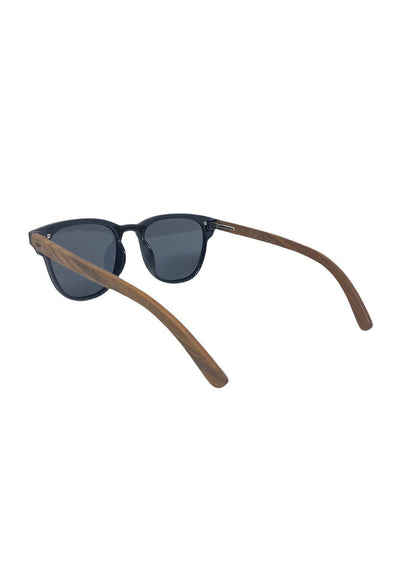 Eyewood tomorrow is our modern cool take on classic models. This is Fornax with black lenses. With walnut wooden sides. Studio shoot from the back.