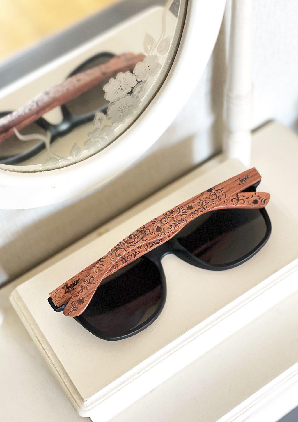 Engraved wood sunglasses from Zerpico. Oasis is handmade with floral pattern.