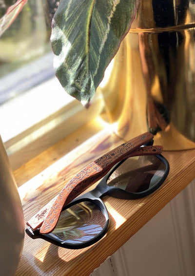 Engraved wood sunglasses from Zerpico. Oasis is handmade with floral pattern.
